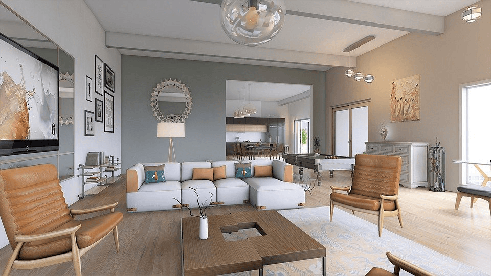 Modern open-concept living room featuring a white sectional sofa and tan leather armchairs.