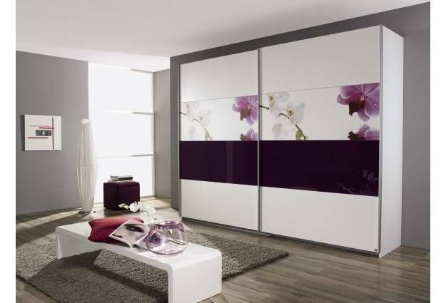 Modern white and purple wardrobe with floral design sliding doors in a contemporary room.