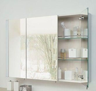 White medicine cabinet featuring two mirrored doors and an open shelving unit with toiletries.