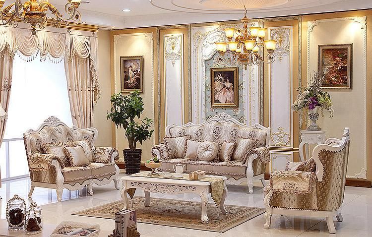 Luxurious living room featuring ornate gold and beige sofa set with classical carved details.