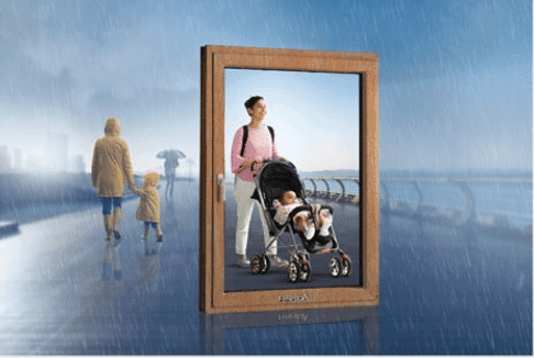 Door in rain opens to sunny scene: parent pushing a baby stroller.